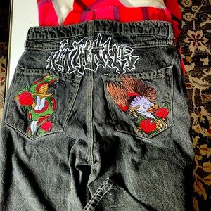 Zumiez loose fit ambush embroidered jeans.